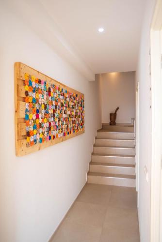 a painting of lego figures on a wall in a hallway at Apartamento Zinha Amwilla Guesthouse in Mindelo