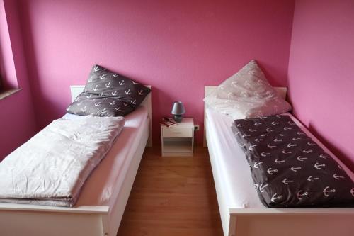 Llit o llits en una habitació de Ferienhaus Helten