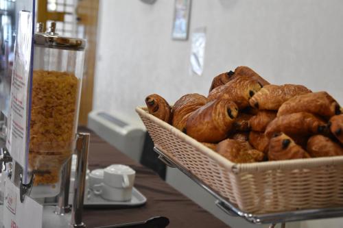 a basket of pastries sitting on a table at Village club de Bois d'Amont in Bois-dʼAmont
