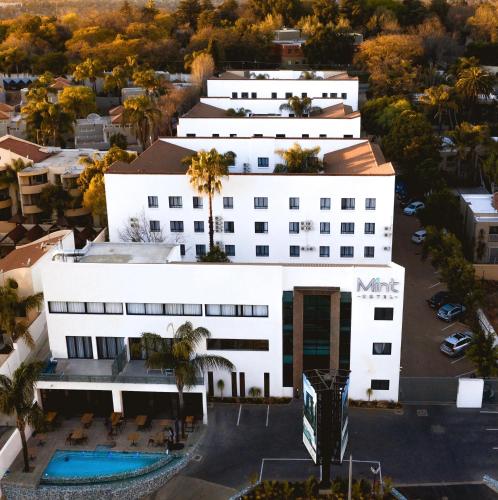 an aerial view of a white building with a pool at MINT Hotel 84 on Katherine in Johannesburg