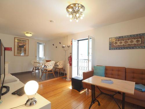 a living room with a couch and a table at Sao Vicente - Lissabon Altstadt in Lisbon