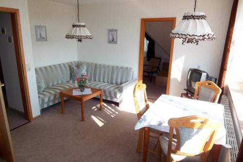 a living room with a couch and a table at Herrmann - Ferienwohnung 3 in Dahme