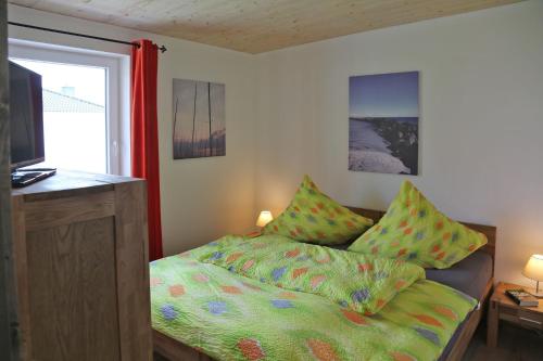 Ένα ή περισσότερα κρεβάτια σε δωμάτιο στο Ferienhaus Rotdorn - Haus Nord