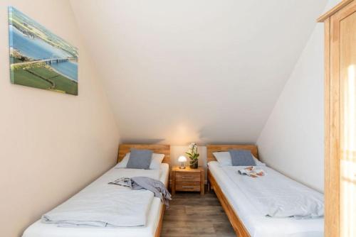 Säng eller sängar i ett rum på Ferienhaus Nelke