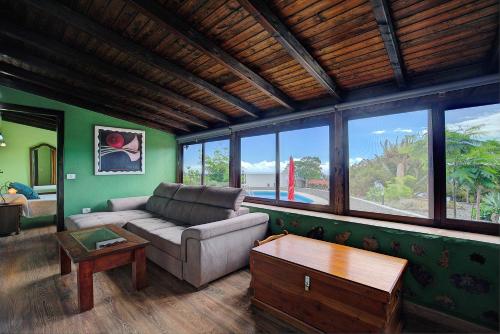 a living room with a couch and a table at CASA RURAL LOS DRAGUITOS 2 in Santa Cruz de la Palma
