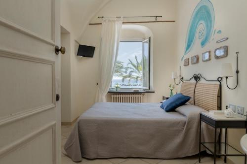 Een bed of bedden in een kamer bij Hotel Vita Serena