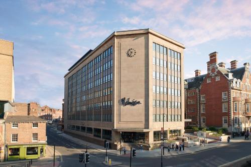 a large building with a clock on the side of it at Malmaison York in York