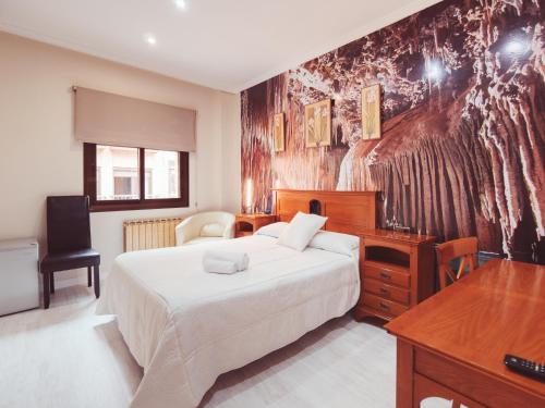 Postel nebo postele na pokoji v ubytování Hotel Los Toreros