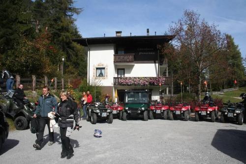 a group of people standing in front of a building at Gästehaus Panorama in Biberwier