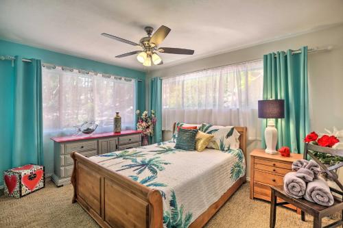a bedroom with a bed and a ceiling fan at Colorful El Cajon Gem Deck, Garden and Valley Views in El Cajon