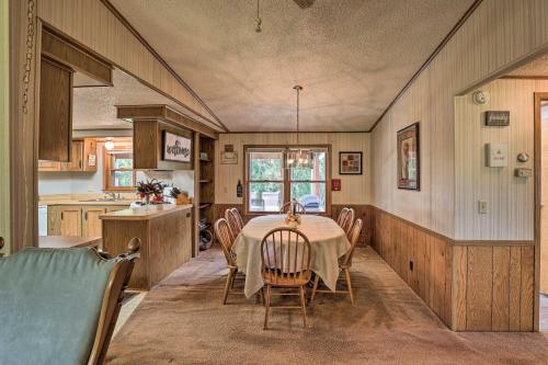a kitchen and dining room with a table and chairs at Charming Burdett Home with Grill, Gazebo and Yard in Burdett