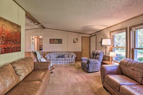 a living room with couches and chairs and a couch at Charming Burdett Home with Grill, Gazebo and Yard in Burdett