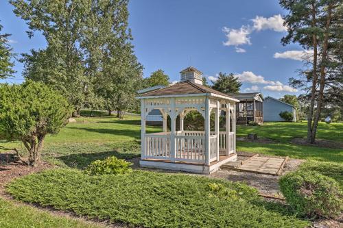 a gazebo in the middle of a yard at Charming Burdett Home with Grill, Gazebo and Yard in Burdett