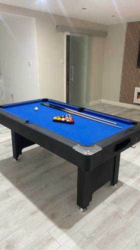 a pool table in a room with at Luxe bungalow Bradford in Wibsey