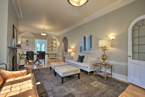 a living room with a couch and a table at Classic Oak Park Home, 11 Mi to Downtown Chicago! in Oak Park
