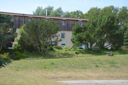 a building with trees in front of it at Quaduxenbarg in Hornstorf