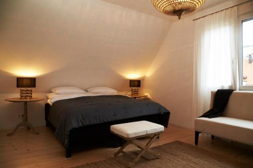 A bed or beds in a room at La Faya "Molerhüsli"- Gemütliches, gehobenes Ferienhaus in Muggenbrunn -Feldberg
