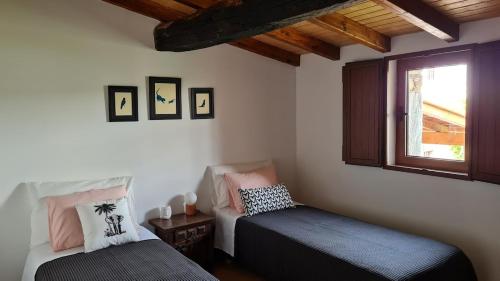 Un pat sau paturi într-o cameră la Casa da Ti Adélia