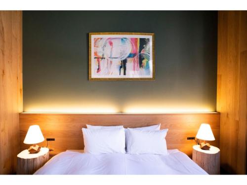 Ένα ή περισσότερα κρεβάτια σε δωμάτιο στο HOTEL KARUIZAWA CROSS - Vacation STAY 56407v