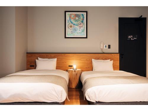 Kama o mga kama sa kuwarto sa HOTEL KARUIZAWA CROSS - Vacation STAY 56456v