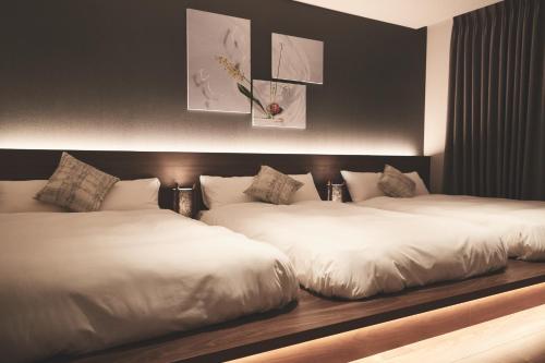 Un pat sau paturi într-o cameră la ReLA Higashimatsudo - Vacation STAY 66379v