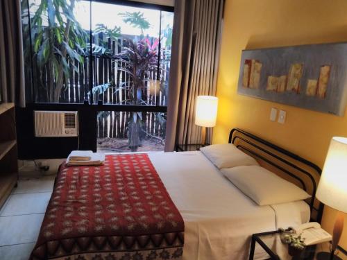 Ένα ή περισσότερα κρεβάτια σε δωμάτιο στο Mansoori Apart Hotel II