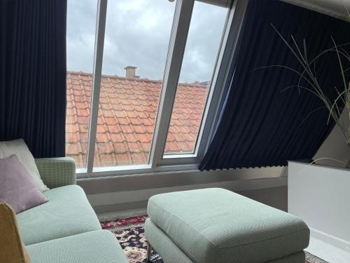 Ein Sitzbereich in der Unterkunft Guesthouse de Loft