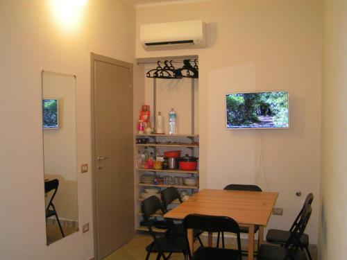 a dining room with a table and chairs at Anania in Cagliari