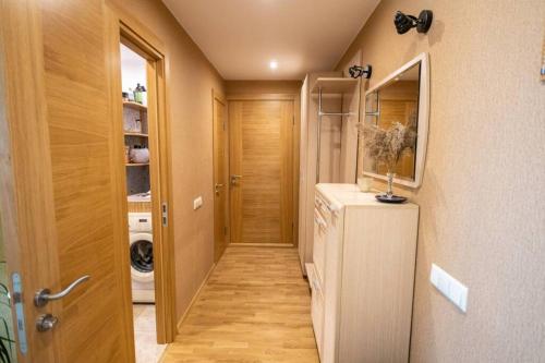 a hallway of a home with a washer and dryer at Beautiful & spacious apartment in Valmiera in Valmiera
