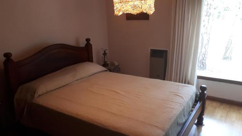 Кровать или кровати в номере Casa En El Bosque