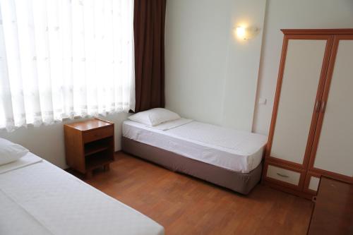 Postel nebo postele na pokoji v ubytování Erol Apart