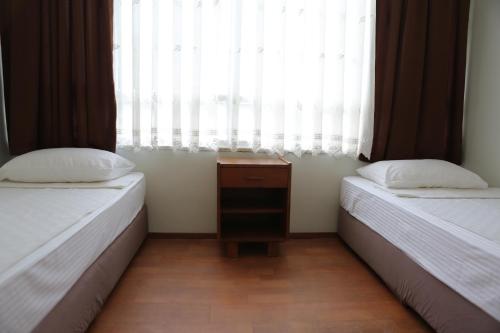 Postel nebo postele na pokoji v ubytování Erol Apart