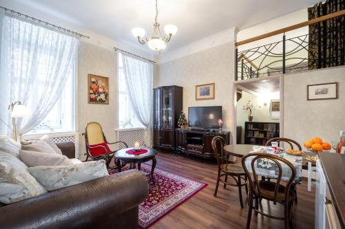 a living room with a couch and a table at Classic Apartments in Old Town in Tallinn