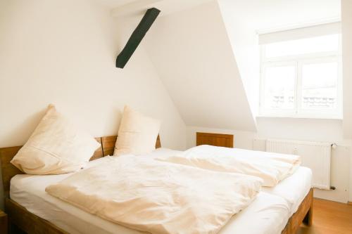 Ένα ή περισσότερα κρεβάτια σε δωμάτιο στο Ferienwohnung Neu "Zum Westerwald" LAHN03