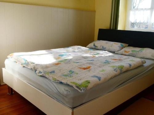 Ένα ή περισσότερα κρεβάτια σε δωμάτιο στο Ostseeferienoase Strand