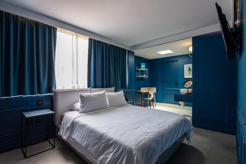 Postel nebo postele na pokoji v ubytování Casa Nada Hotel