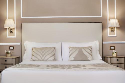 Katil atau katil-katil dalam bilik di Hotel Nuovo Teson