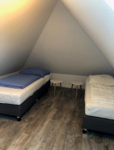 A bed or beds in a room at Trafohaus