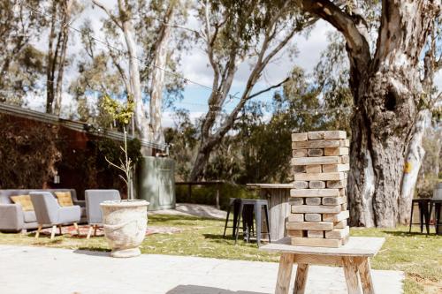 a stack of bricks sitting on a bench in a yard at Tindarra Resort in Moama