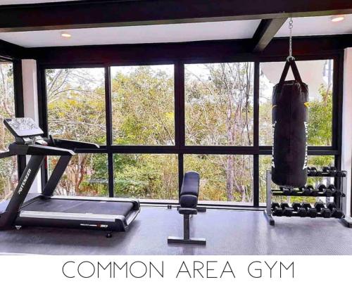 a gym with a punching bag hanging from a window at Casa Xaman in Tulum - TH 5 in Tulum
