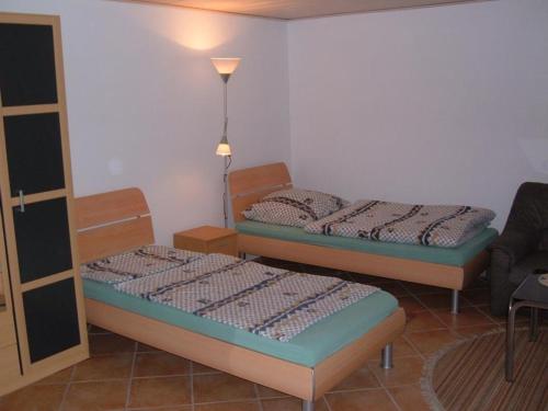 Säng eller sängar i ett rum på Appartement Altes Land Jork bei HH