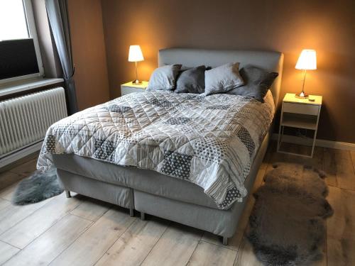 Ένα ή περισσότερα κρεβάτια σε δωμάτιο στο Ferienwohnung Wasserslebener Weg