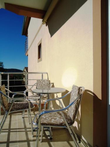 a patio with a table and chairs on a balcony at Apartments Nedovic-Jaz in Budva