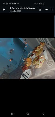 a picture of a table with two slices of pizza at Il Daviduccio ibla in Ragusa