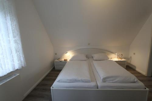 Postel nebo postele na pokoji v ubytování Haus Seepferdchen - Whg 9