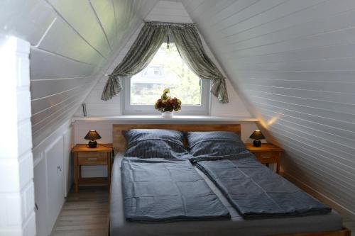 Ένα ή περισσότερα κρεβάτια σε δωμάτιο στο Frietied am Wittensee