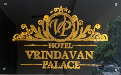 a sign for the hotel vancouver palace at Hotel Vrindavan Palace in Indore
