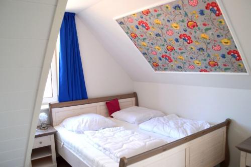 En eller flere senge i et værelse på Dreamhus Borgsum