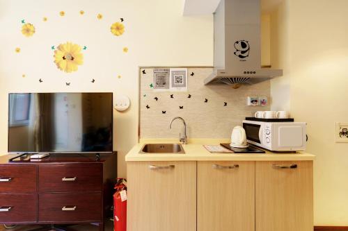Kuchyň nebo kuchyňský kout v ubytování Gubei Town Boutique Homestay