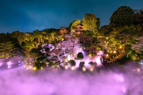 an aerial view of a park at night at Hotel Chinzanso Tokyo in Tokyo